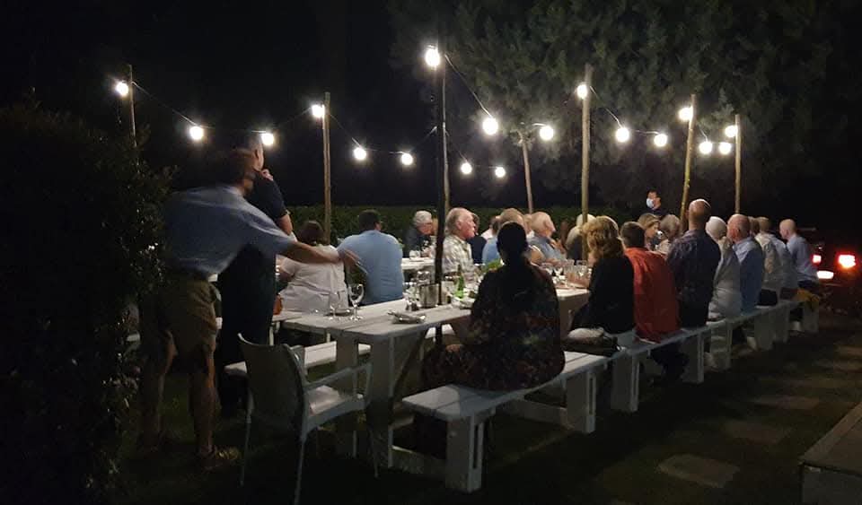Poolside dining Summers at Harvest Table Bistro calls for long tables with fairy lights (in the garden)